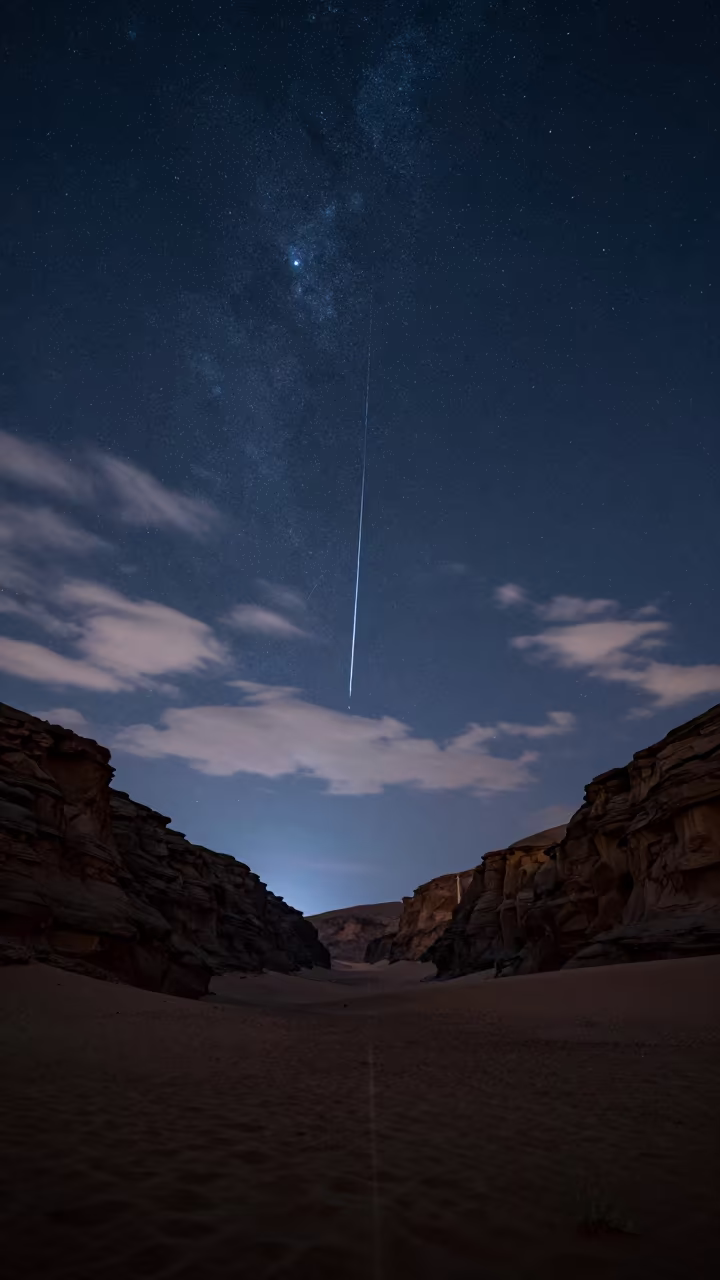 Meteor Shower Trails Over Muscat Canyon at Night in beneath thin cloud gaps and stars near Muscat