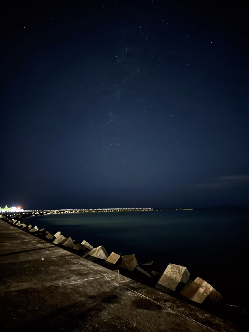 Meteor Streak Over Sandakan Breakwater Night in from a moonlit breakwater near Sandakan