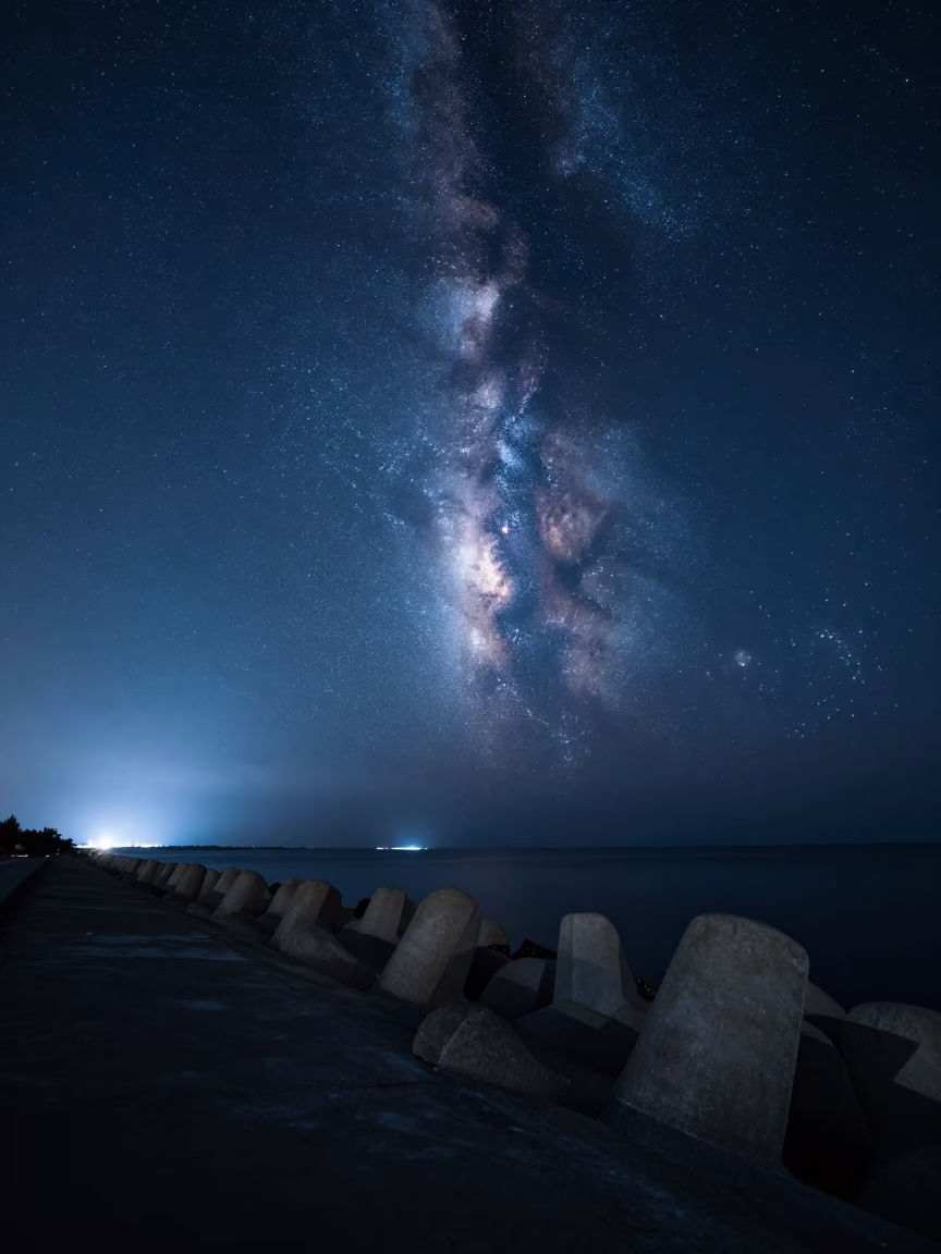 Meteor Streaks Past Milky Way Over Haikou Moonlit Breakwater in from a moonlit breakwater near Haikou