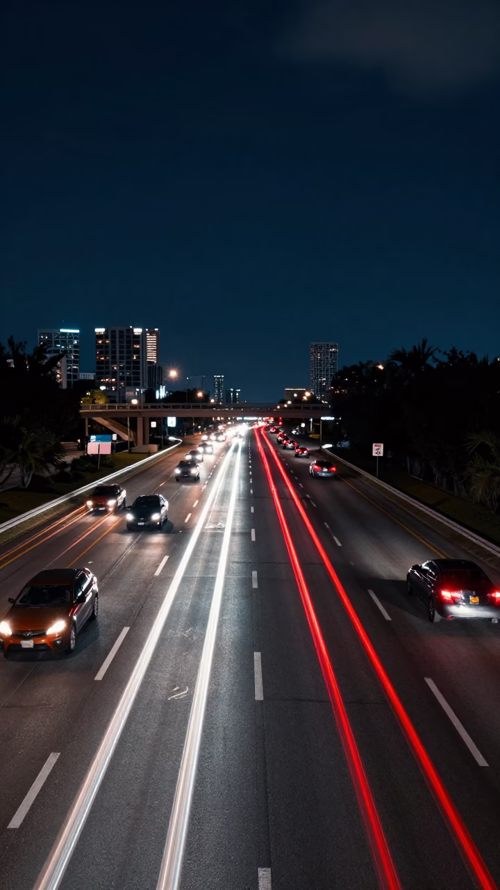 Miami Midnight Overpass Interchange Lane Split Lit by Taillight Streaks in in Miami, Florida, United States