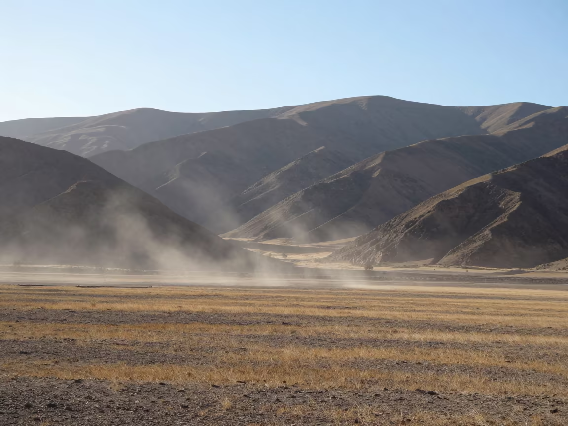 Microbe Burst Pushes Rain Sideways Across Sanaa Prairie in across a wide valley floor near Sanaa