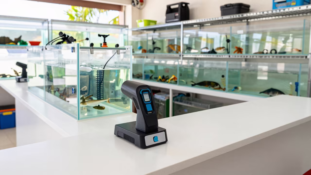 Microchip Scanner Dock Before Pet Workflows Begin in inside a fish bagging counter zone in Malabo