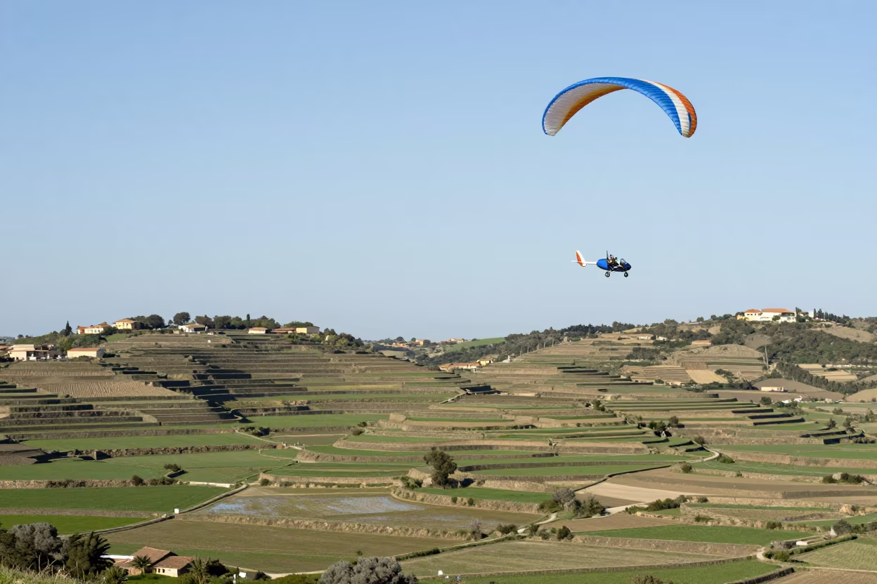 Microlight Flies Over Sardinian Rice Terraces in among terraced rice paddies in Sardinia