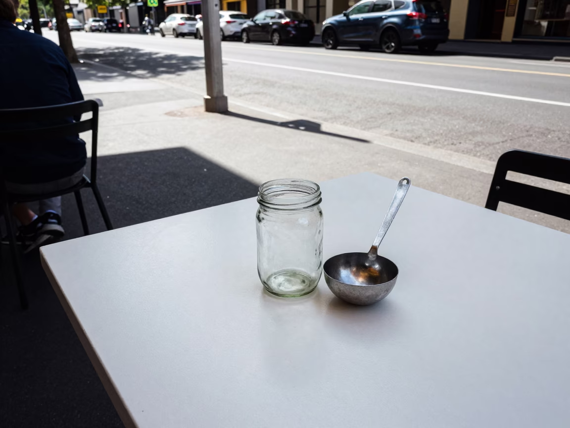 Midday Melbourne Street Scene with Jar and Ladle on Cafe Table in in Melbourne, Victoria, Australia