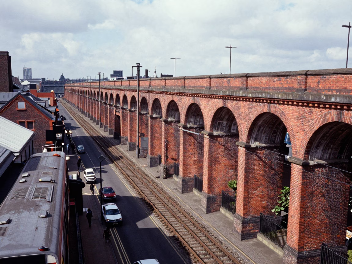 Midday Railway Viaduct and Passing Train in Liverpool United Kingdom Street Scene in in Liverpool, United Kingdom