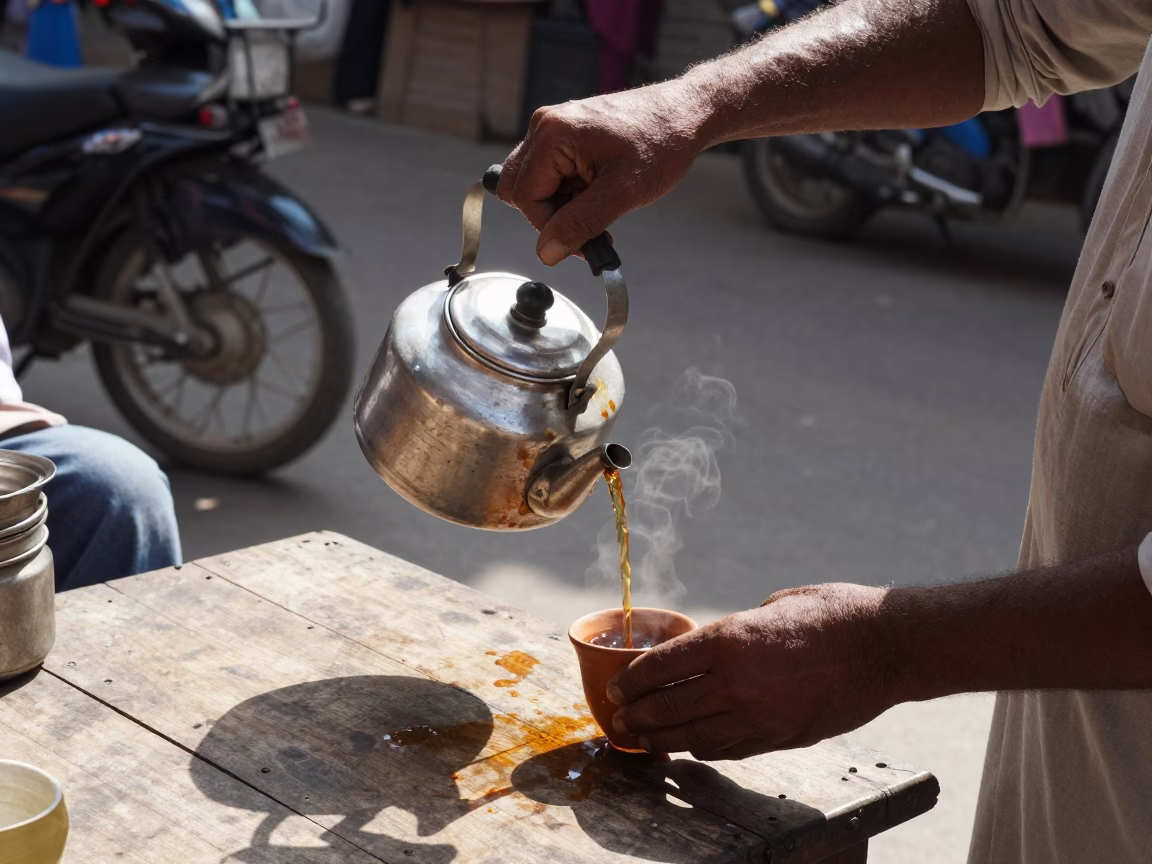 Midday Street Scene in Delhi India with Tea Kettle and Sunlight Reflections in in Delhi, India