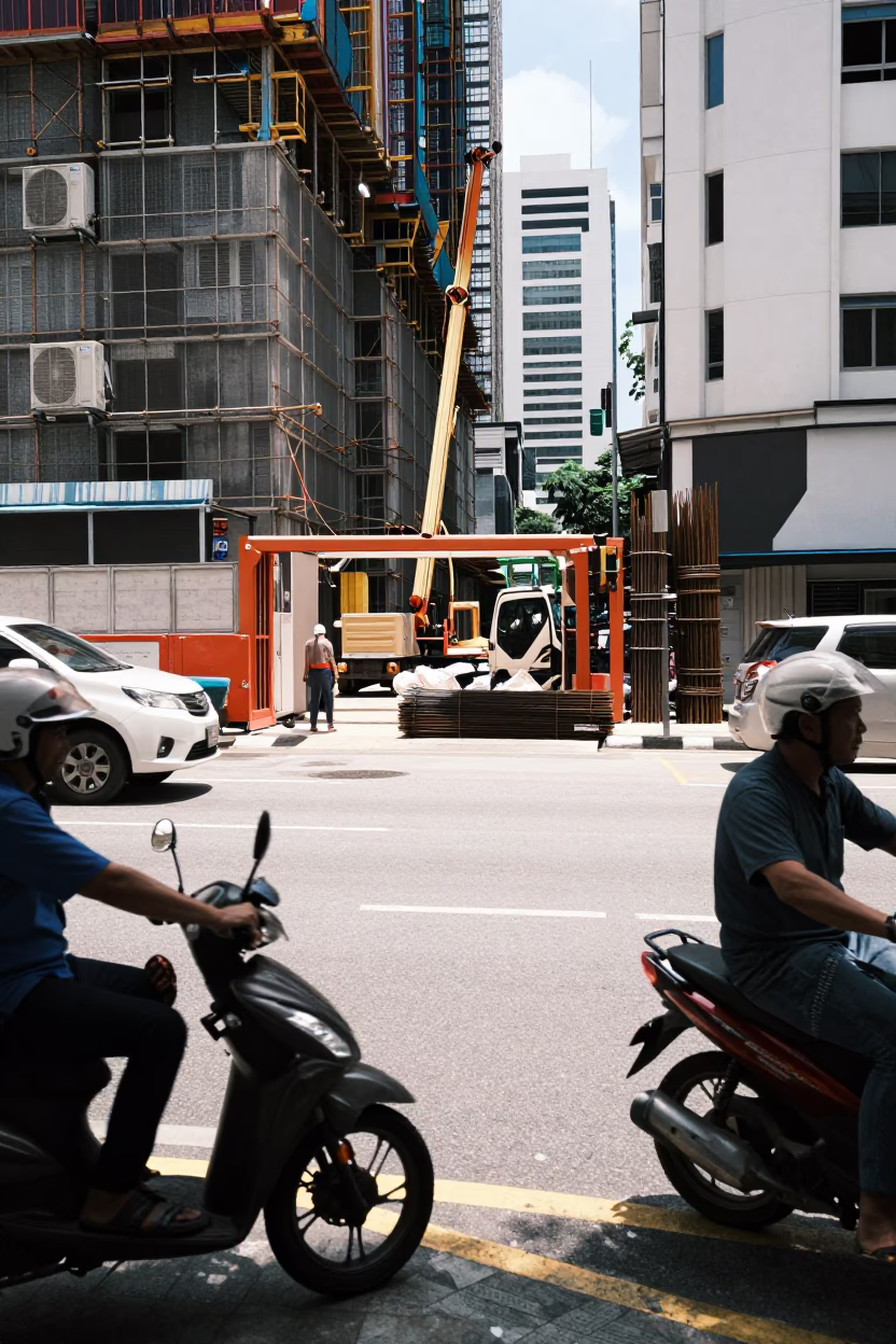 Midday Street Scene in Kuala Lumpur Malaysia with Construction Site and Local Vendor in in Kuala Lumpur, Malaysia