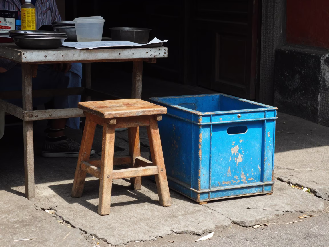 Midday Street Scene in Yogyakarta Indonesia with Wooden Stool and Painted Crate in in Yogyakarta, Indonesia