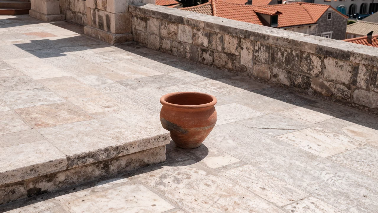 Midday Sunlight on Ancient Dubrovnik Stone Terrace with Terracotta Bowl and Peaches in in Dubrovnik, Croatia