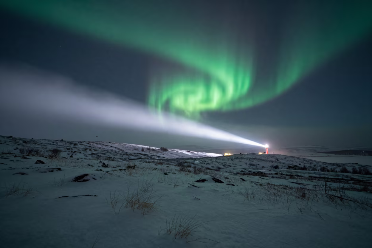Midnight Aurora Over Winter Tundra Near Oslo in from a ridge above layered foothills near Oslo