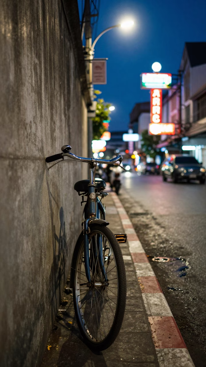 Midnight Bangkok Street Scene with Vintage Bicycle and Local Night Market Activity in in Bangkok, Thailand