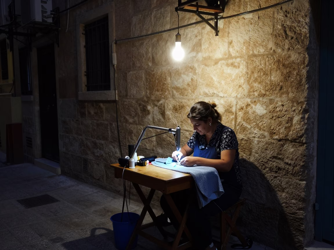 Midnight Beirut Street Scene with Seamstress and Rotary Cutter in 1970s Lebanon in in Beirut, Lebanon