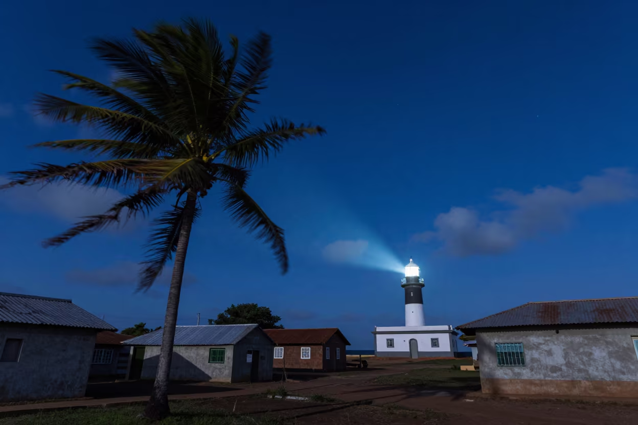 Midnight Blue Sky Over Sleeping Luanda Village in beneath thin cloud gaps and stars near Luanda