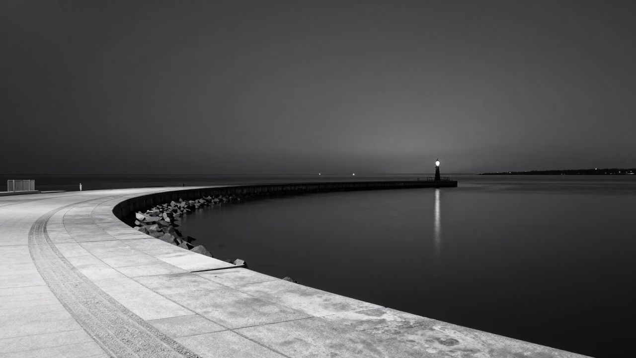 Midnight Copenhagen Harbor Scene with Breakwater Curve and Lonely Harbor Beacon Lighting the Water in in Copenhagen, Denmark