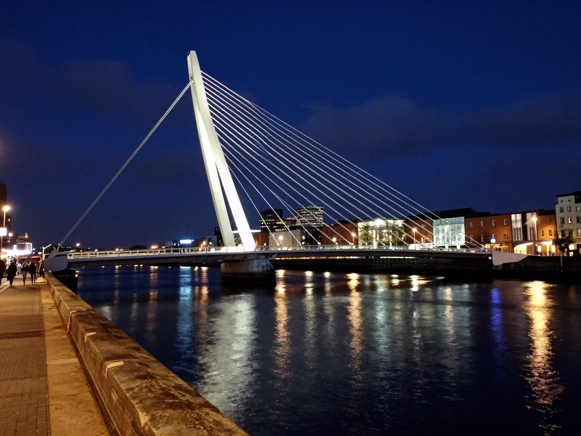 Midnight Dublin Street Scene with Illuminated Cable-Stayed Bridge and Harbor Reflections in in Dublin, Ireland