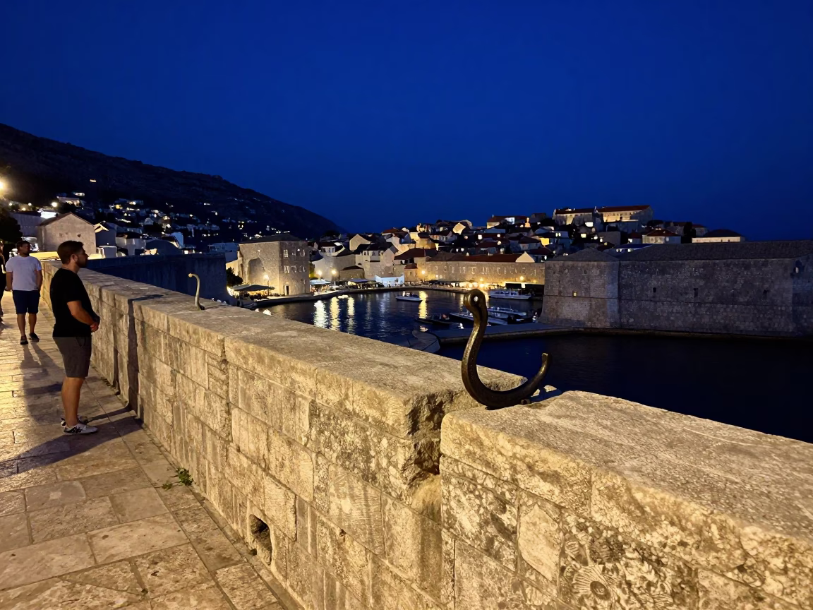 Midnight Dubrovnik Harbor Scene with Iron Hook and Goblet on Stone Wall in in Dubrovnik, Croatia