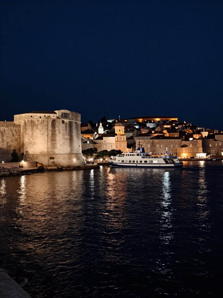 Midnight Dubrovnik Harbor View with Ferry Leaving Port Against Dark Adriatic Sky in in Dubrovnik, Croatia