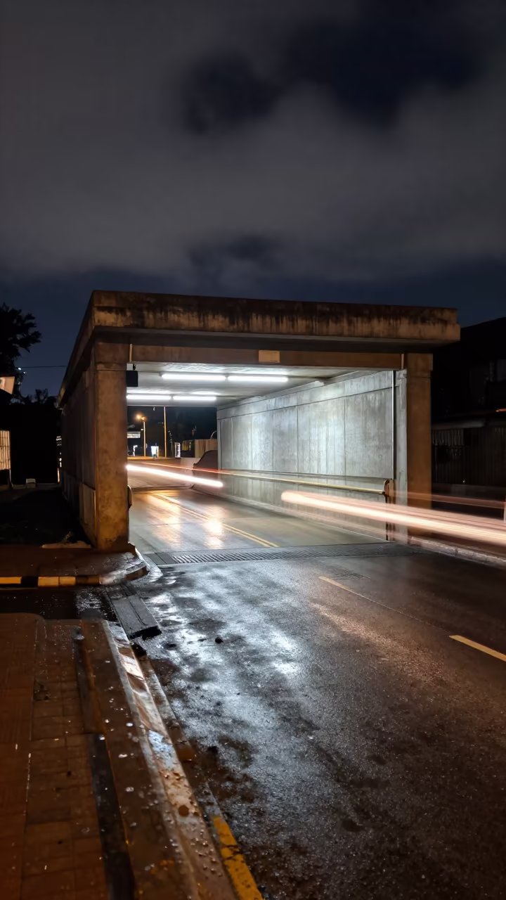 Midnight Headlight Reflections in Kumasi Underpass in outside a metro entrance in Kumasi