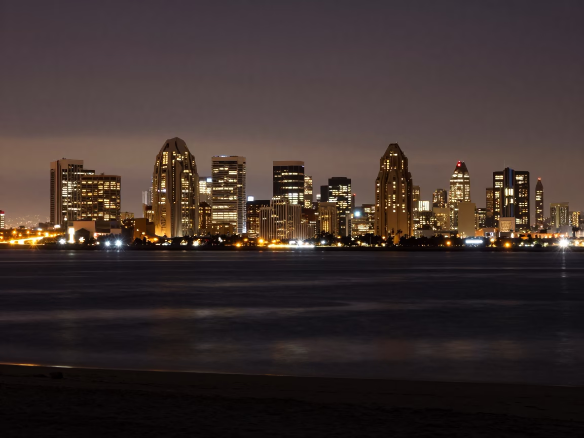 Midnight Highway View of San Diego City Skyline Illuminated Against Dark Ocean Horizon in in San Diego, California, United States