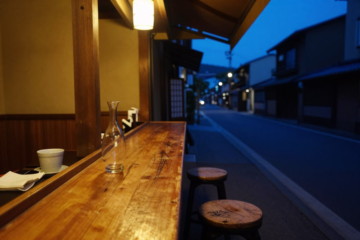 Midnight Kyoto Street Scene with Glass Vase and Coffee Cup on Wooden Counter in in Kyoto, Japan