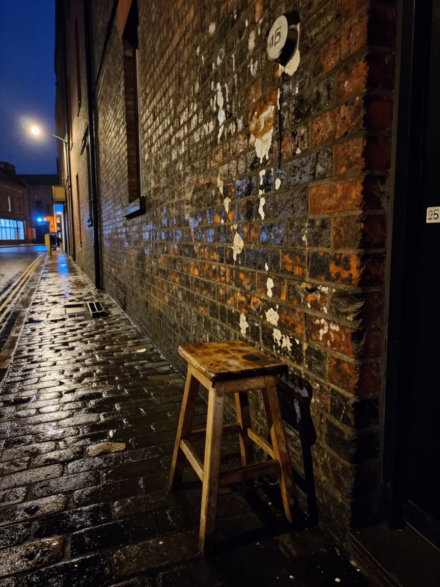 Midnight Liverpool Street Scene with Grease Sheen and Stool Outside Closed Pub in in Liverpool, United Kingdom