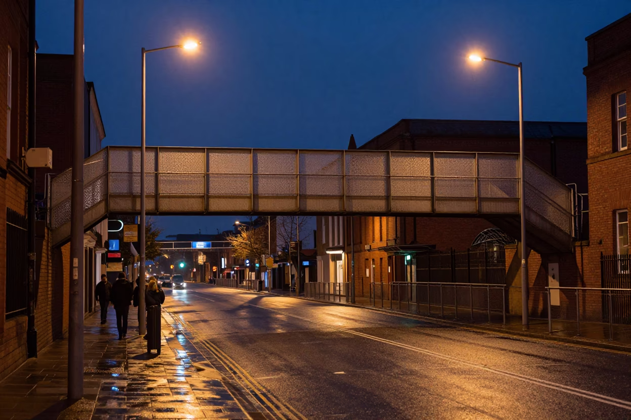 Midnight Liverpool Street Scene with Perforated Metal Overpass and Wet Footsteps in in Liverpool, United Kingdom