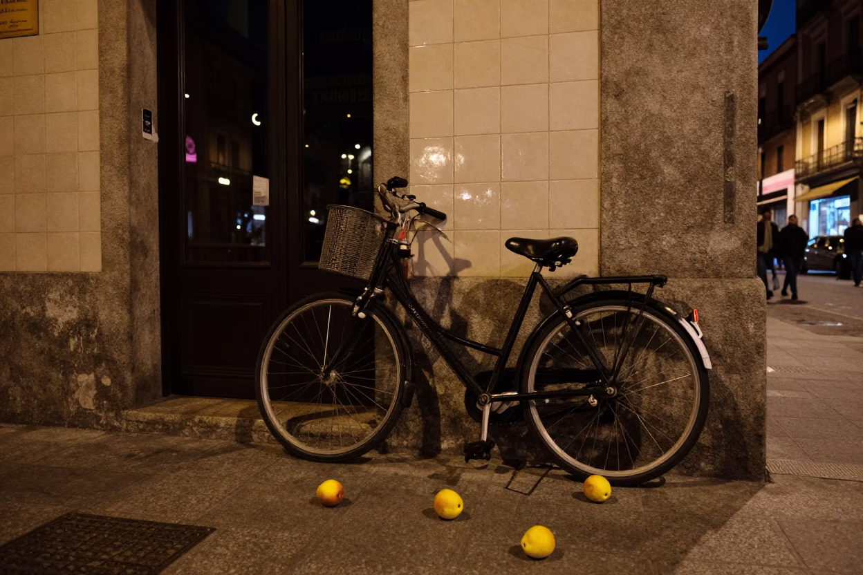 Midnight Madrid Street Scene with Bicycle and Nectarines on Cobblestone in in Madrid, Spain