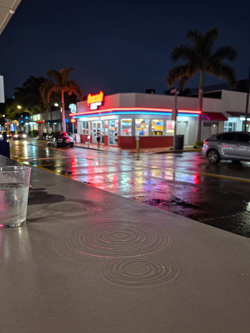 Midnight Miami Street Scene with Water Rings on Countertop and Painted Crate in in Miami, Florida, United States