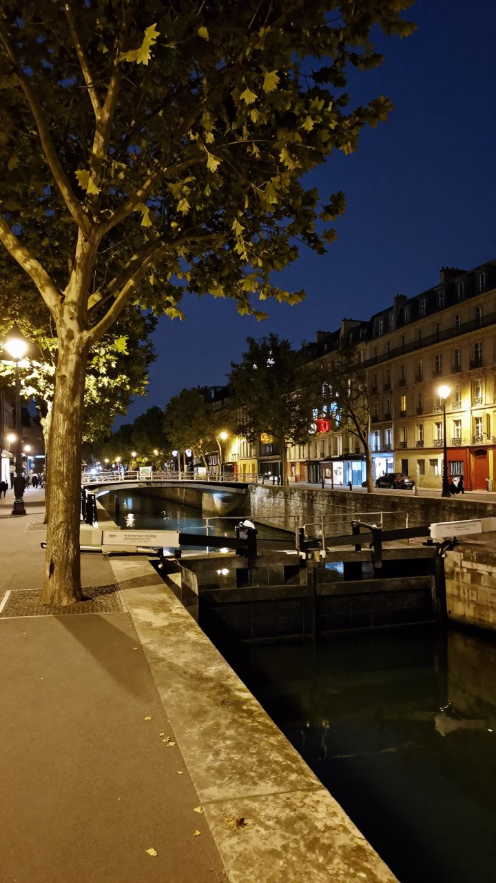 Midnight Paris Street Scene with Tree and Canal Lock Gate in in Paris, France