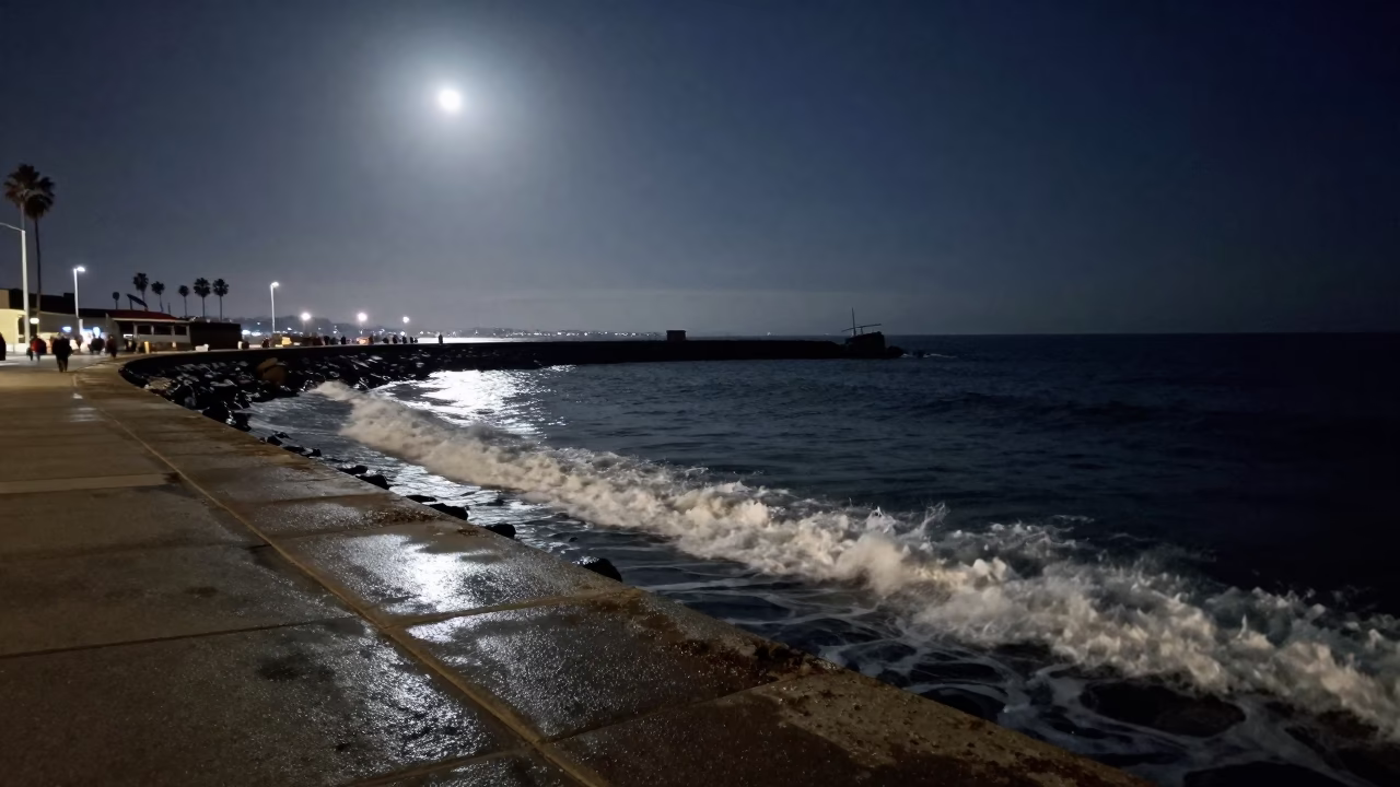 Midnight San Diego Harbor Scene with Moonlit Surf and Breakwater Beacon in in San Diego, California, United States
