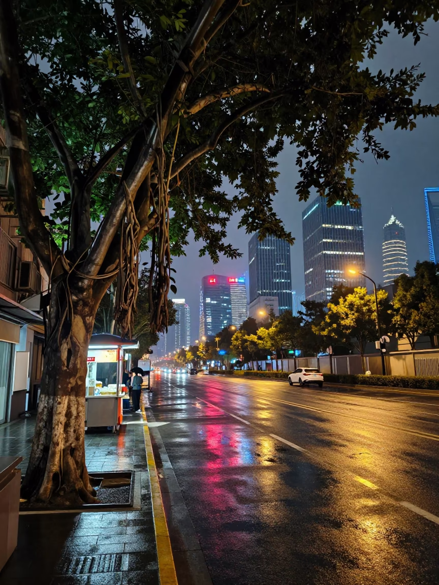 Midnight Shanghai Street Scene with Banyan Tree and Glass Tumbler Reflections in in Shanghai, China