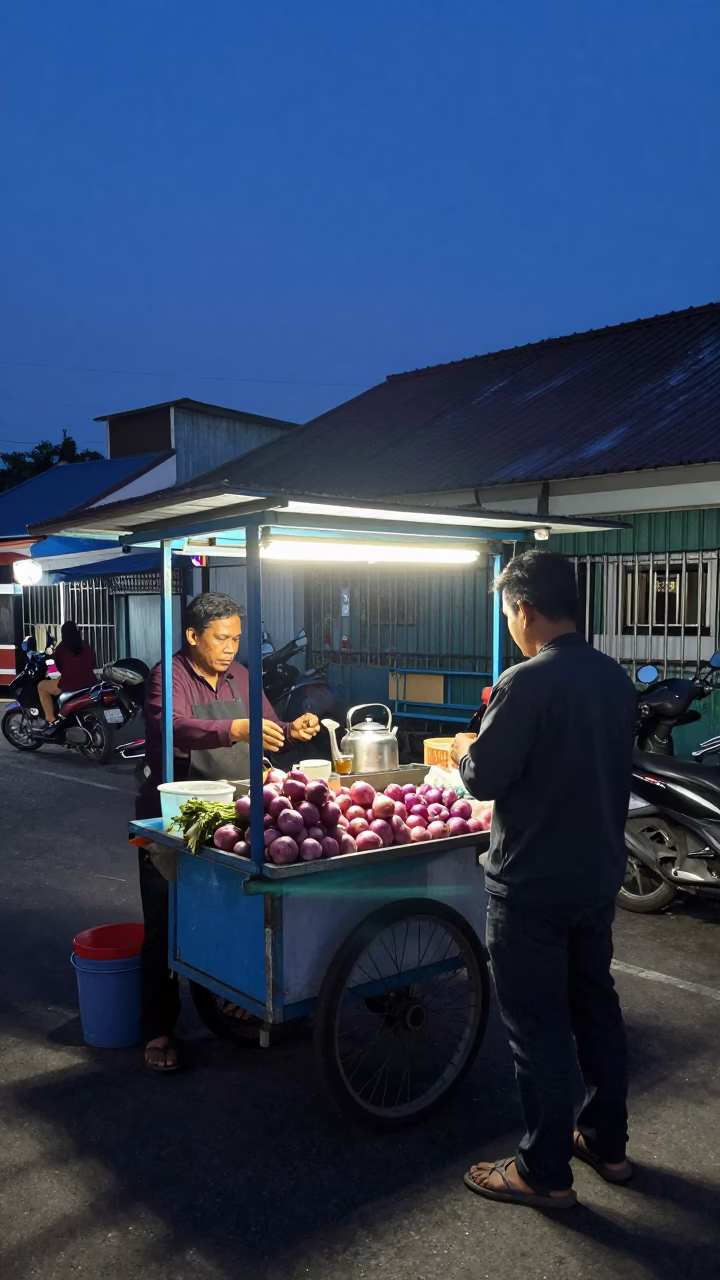 Midnight Street Food Stall in Surabaya with Tea Seller and Onions in in Surabaya, Indonesia