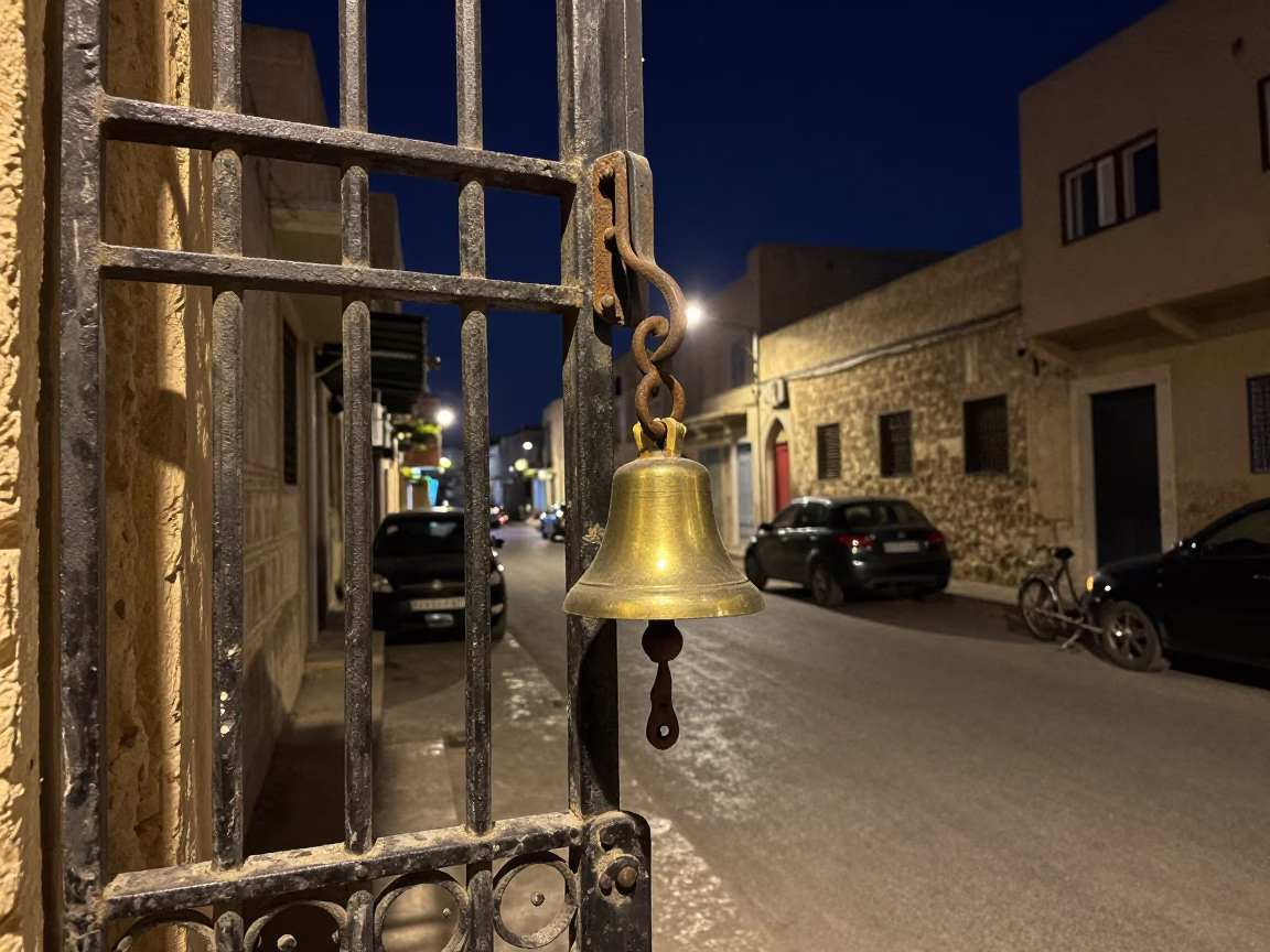 Midnight Street Scene in Alexandria Egypt with Bell and Gate Handle in in Alexandria, Egypt
