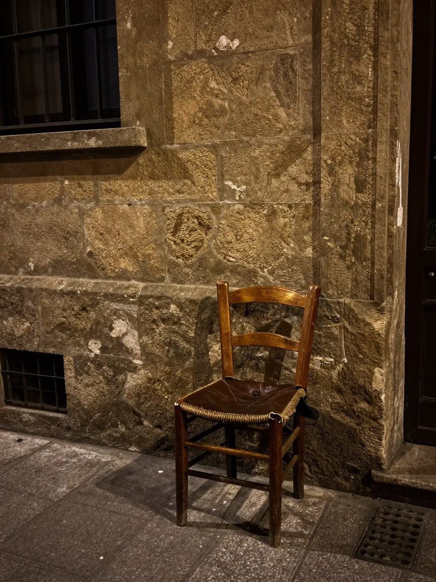 Midnight Street Scene in Bilbao Spain with Vintage Chair and Leather Basketball in in Bilbao, Spain