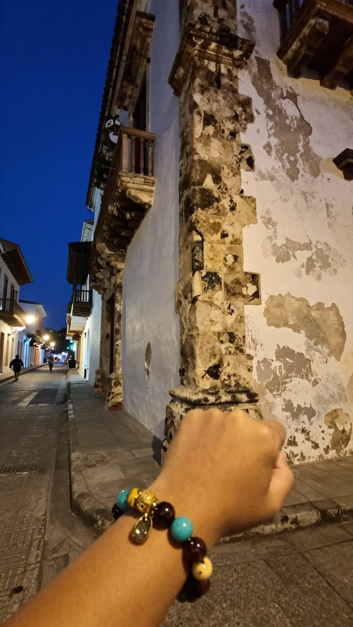 Midnight Street Scene in Cartagena Colombia with Vintage Charm Bracelet and Glass Bottles in in Cartagena, Colombia