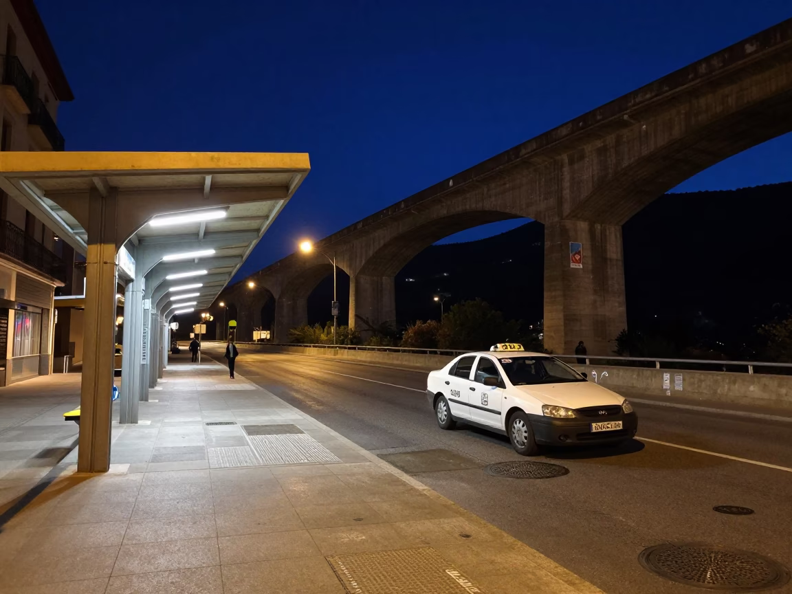 Midnight Street Scene in Granada Spain with Taxi Rank and Concrete Viaduct in in Granada, Spain