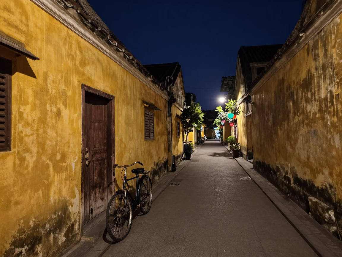 Midnight Street Scene in Hoi An Vietnam with Bicycle and Colored Glass Bottle in in Hoi An, Vietnam