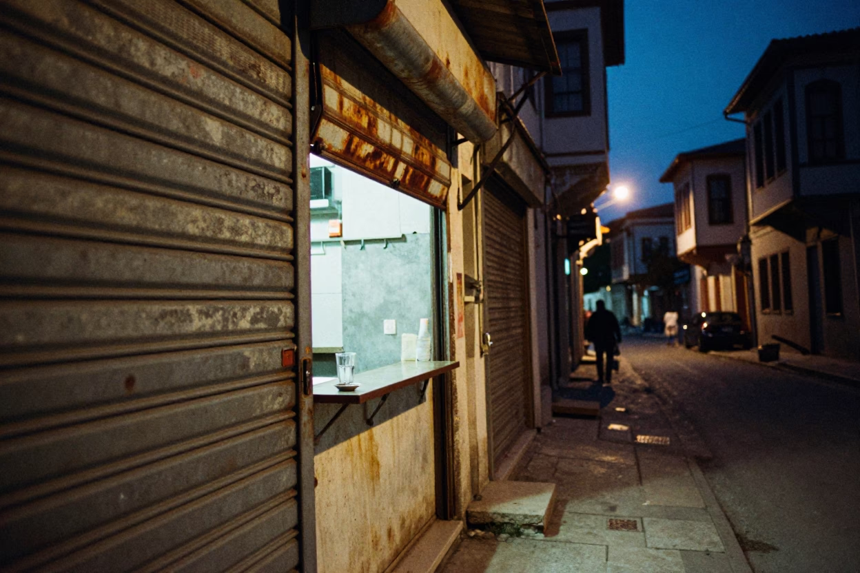 Midnight Street Scene in Izmir Turkey with Glass Tumbler and Rusty Bowl in in Izmir, Turkey