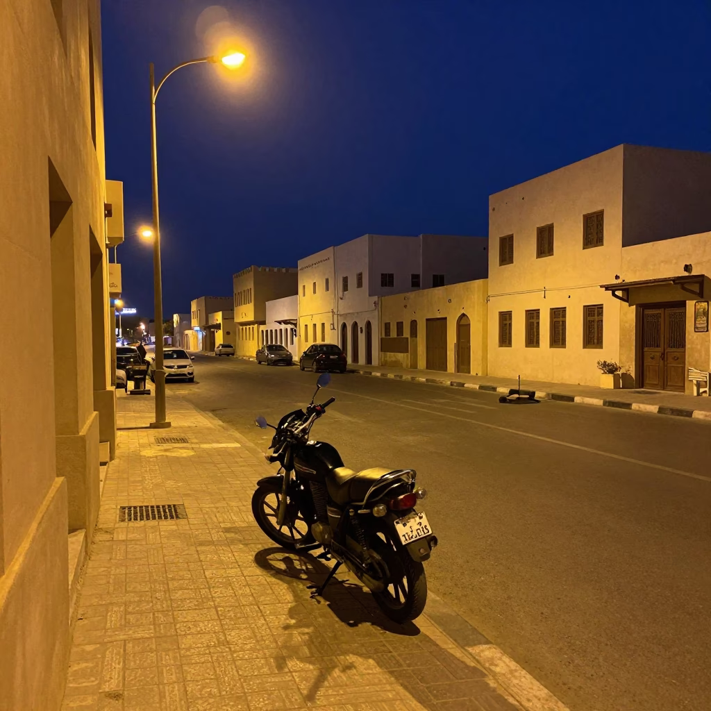 Midnight Street Scene in Muscat Oman with Motorcycle and Boot Scraper in in Muscat, Oman