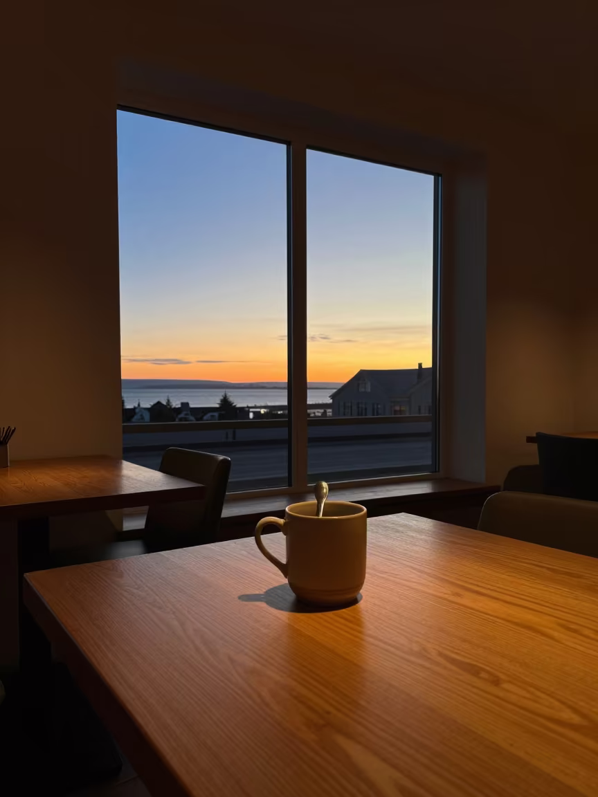Midnight Sun Over Reykjavik Cafe in on a cafe table by a window in Reykjavik