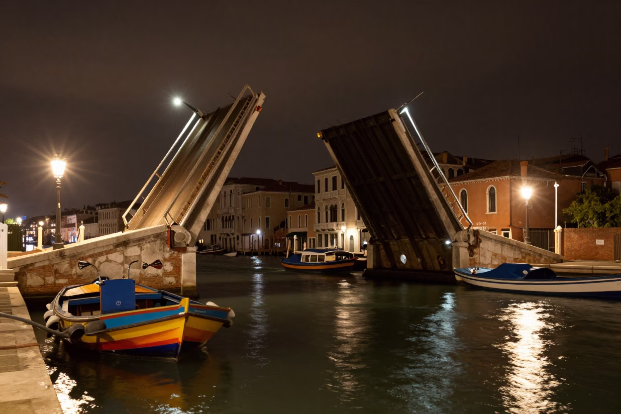 Midnight Venice Canal Drawbridge Lifted with Colorful Traditional Boats and Lantern Light Reflections in in Venice, Italy
