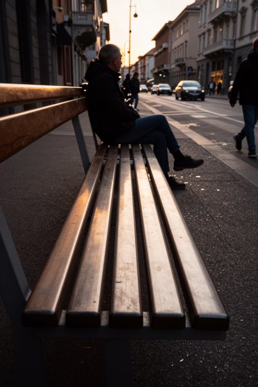 Milan Evening Street Scene with Brushed Steel Bench and Local Artichokes in Honeyed Light in in Milan, Italy
