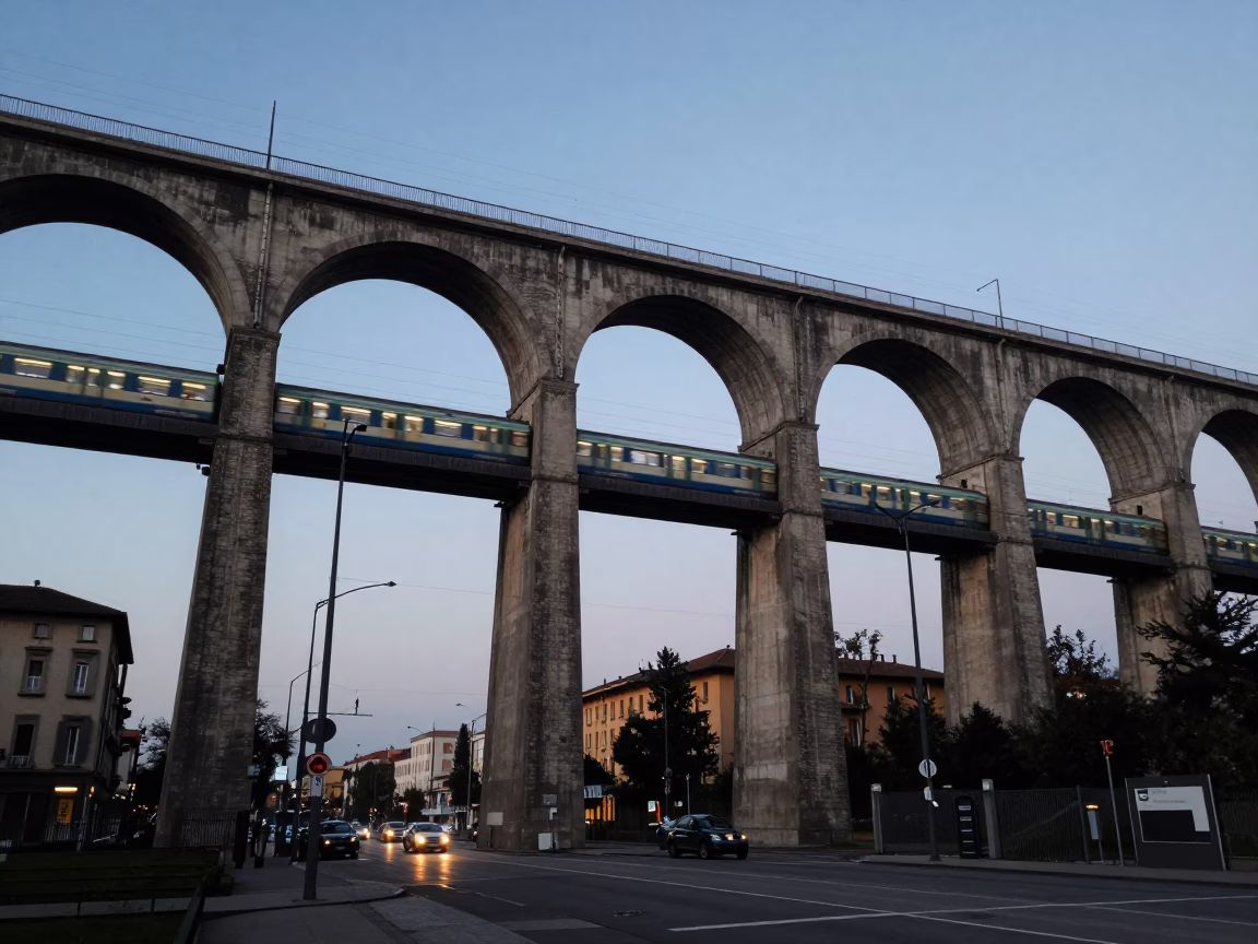 Milan Italy Early Evening Railway Viaduct Arching Over Street With Skateboarder in in Milan, Italy