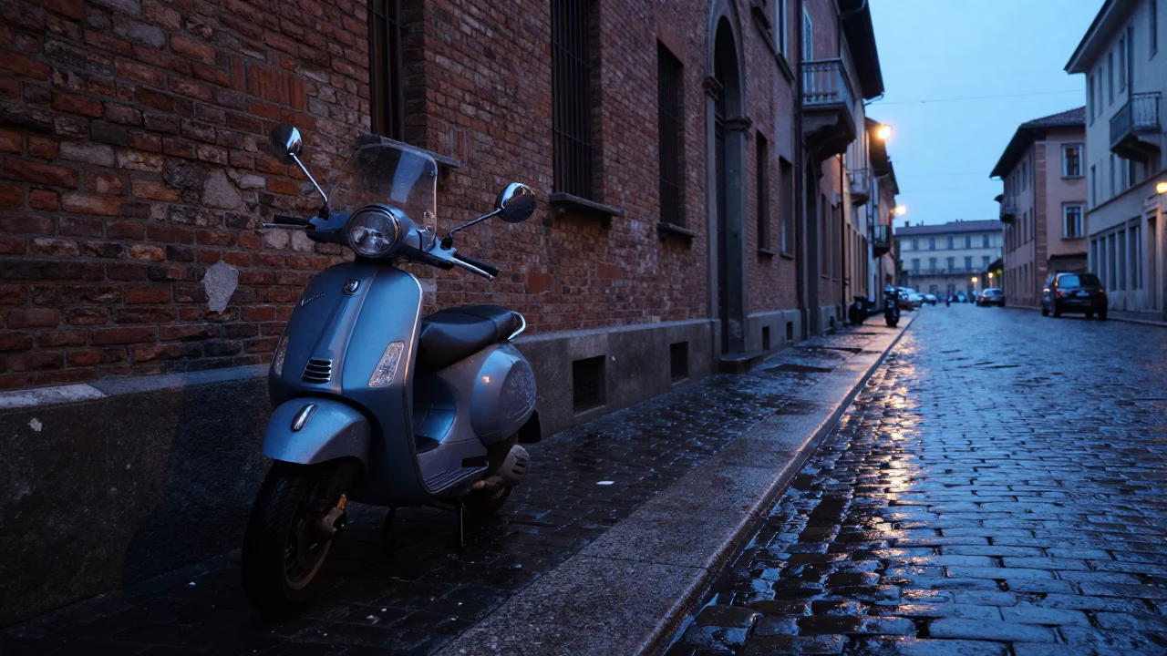 Milan Italy Pre-Dawn Street Scene With Wet Cobblestones And Parked Scooters in in Milan, Italy