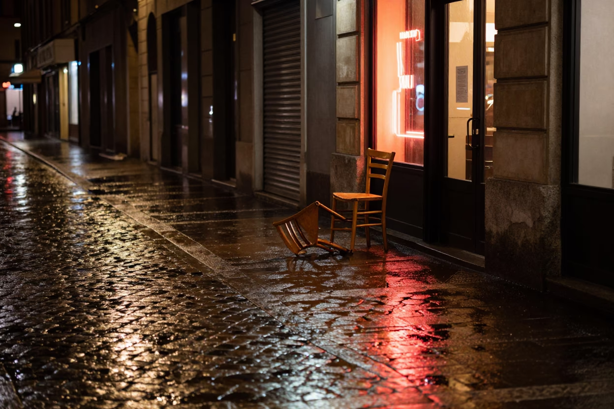 Milan Night Street Scene with Neon Reflections and Empty Café Table in Italy in in Milan, Italy