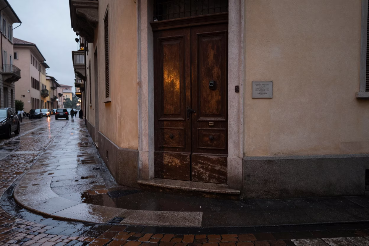 Milan street corner after rain with wet pavement and old door mat in in Milan, Italy