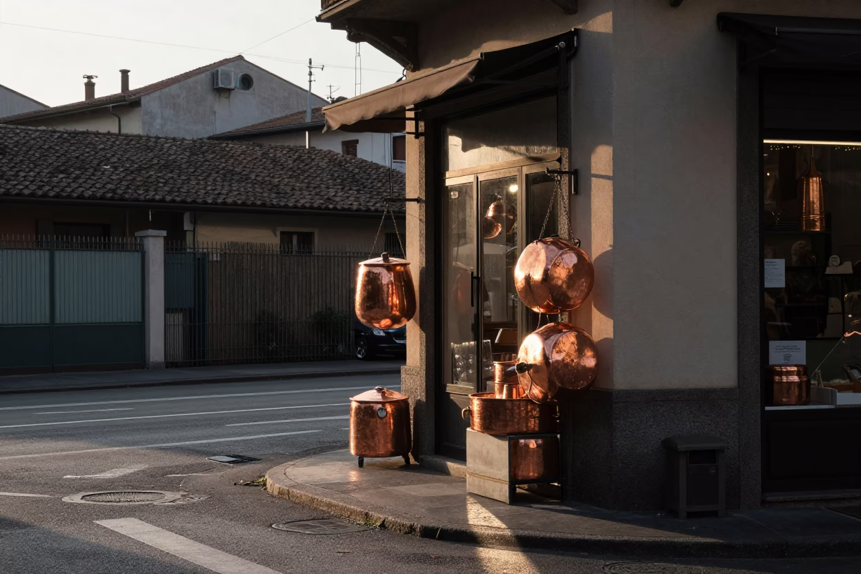 Milan Street Corner Morning Light Reflecting on Copper Pots and Peg Rails in in Milan, Italy