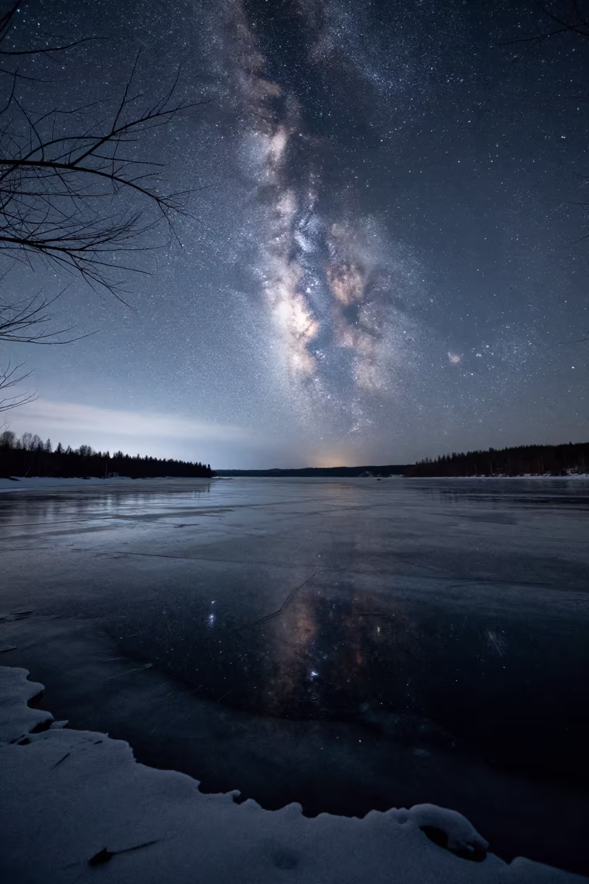 Milky Way Reflected on Frozen Russian Lake Ice in under a band of cold starlight in Russia
