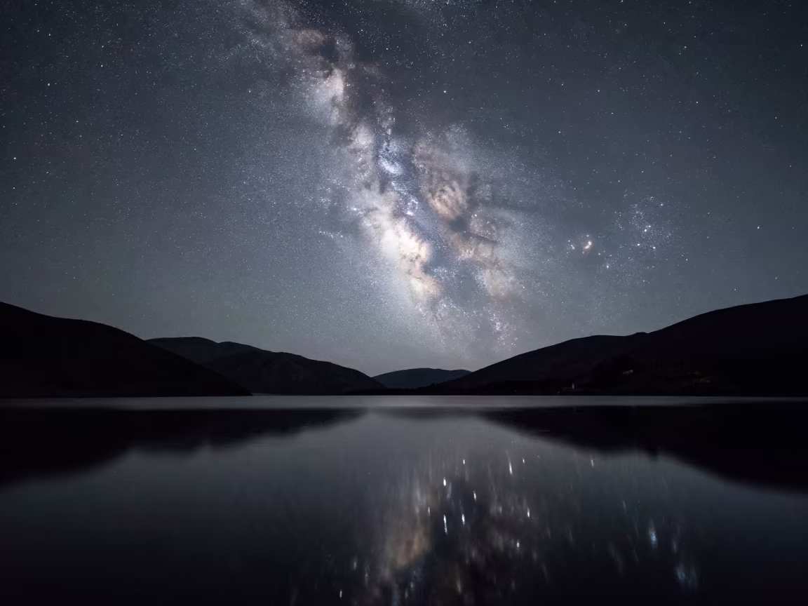 Milky Way Reflected in Still Alpine Lake Ecuador in under the clearest stretch of sky in Ecuador