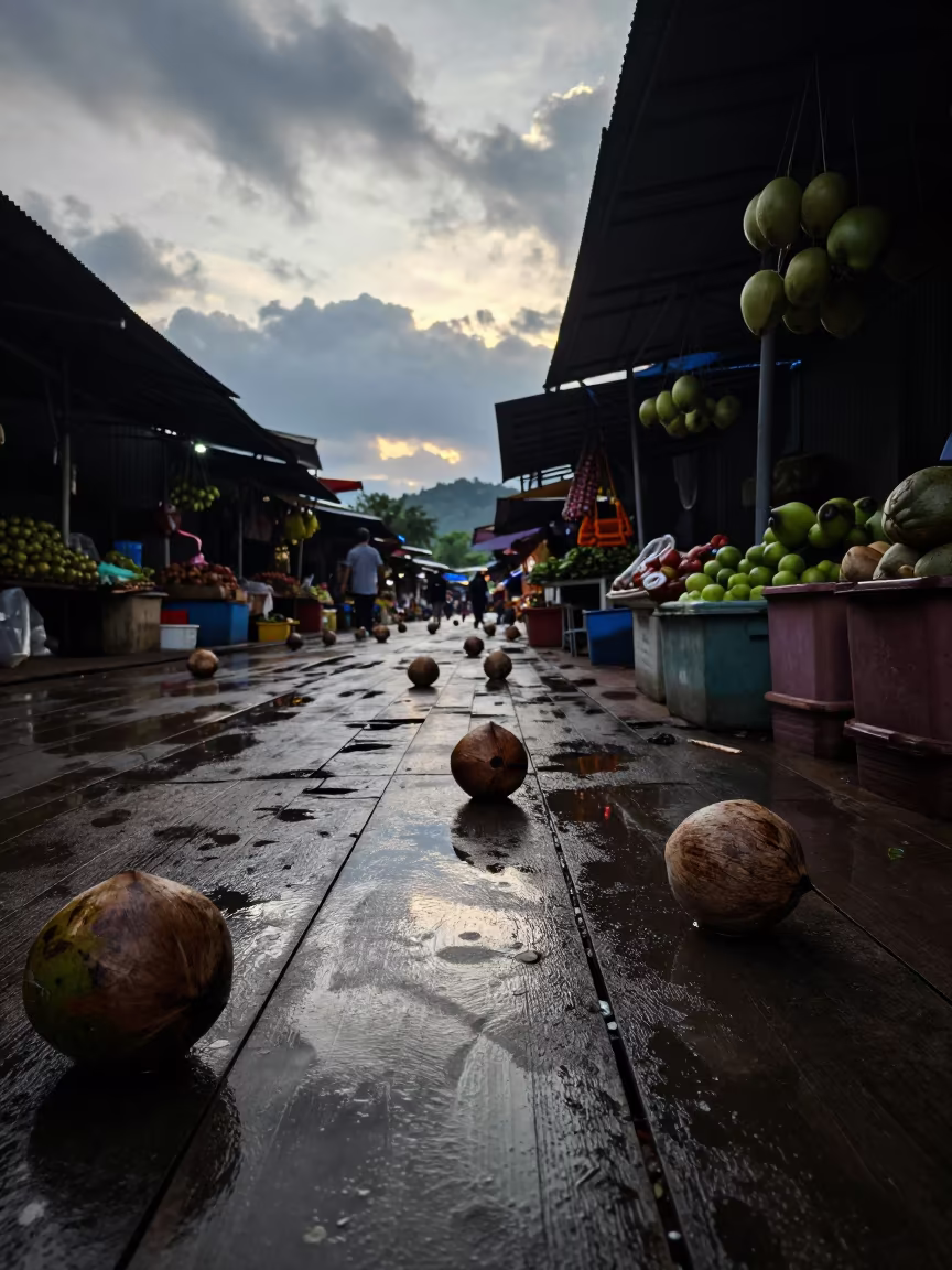 Mirrored Coconuts Floating at Dawn Market in in a flea market lane in Nanning